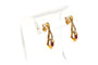 Boucles d'oreilles Boucles d'oreilles contemporaines en or jaune, serties de diamants et de rubis 58 Facettes 18367