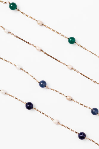 Bracelet Lot de quatre bracelets en or jaune et perles 58 Facettes