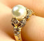 Bague 52 Bague en or jaune 18 carats, perle et 38 diamants 58 Facettes AB448