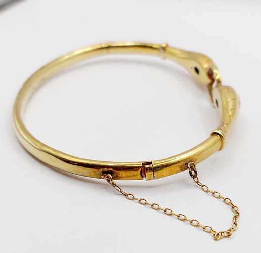 Bracelet Bracelet serpent à deux têtes or jaune et pierre bleues (circa 1920) 58 Facettes A06347