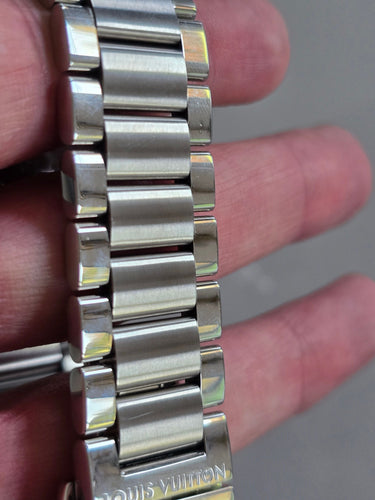 Montre Louis Vuitton - Montre chronographe Tambour Voyage en acier 58 Facettes