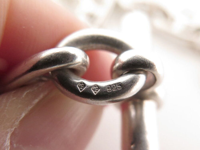 Bracelet vintage bracelet HERMES chaine d'ancre breloques marines t16 en argent 925 58 Facettes 267839