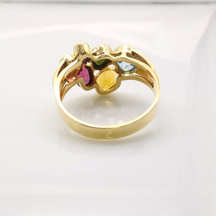 Yellow gold ring with precious stones