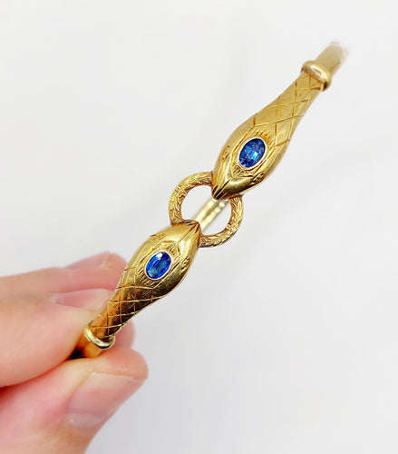 Bracelet Bracelet serpent à deux têtes or jaune et pierre bleues (circa 1920) 58 Facettes A06347