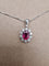 Pendentif Pendentif en or blanc avec rubis et diamants 58 Facettes