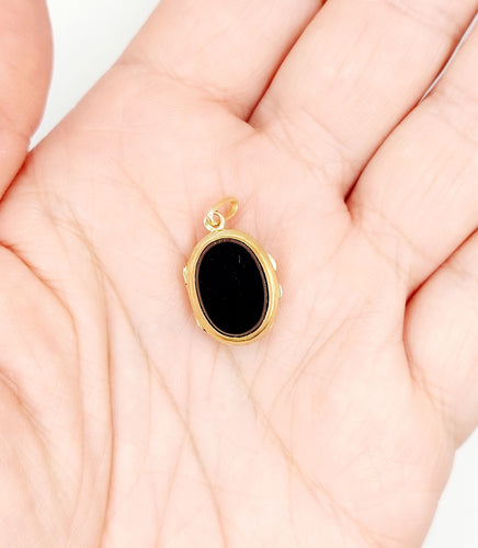 Pendentif Pendentif porte-photo or jaune et onyx (circa 1900) 58 Facettes A05916