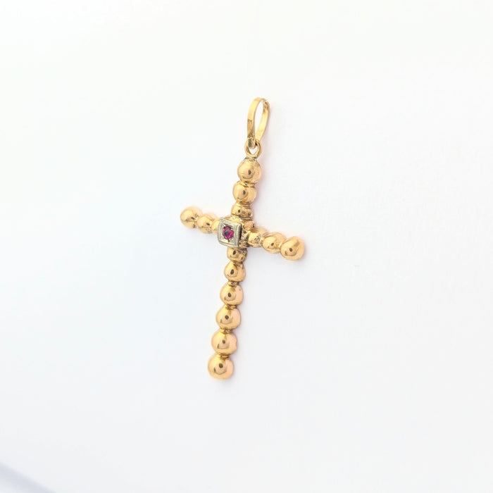 Yellow gold and ruby cross pendant