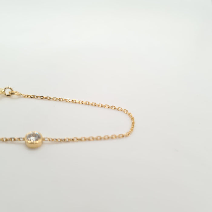 Yellow gold bracelet set with a diamond