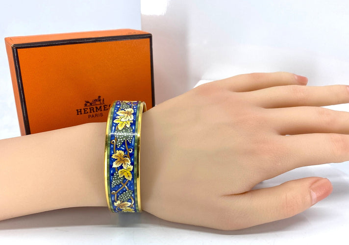 Bracelet HERMÈS - bracelet en métal doré et émail 58 Facettes AB657