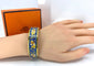 Bracelet HERMÈS - bracelet en métal doré et émail 58 Facettes AB657