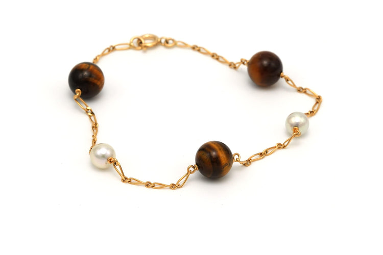 Bracelet Bracelet contemporain en or jaune, perles et œil de tigre 58 Facettes 13428