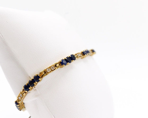 Bracelet Bracelet rivière de diamants et de saphirs, or jaune 58 Facettes 240045