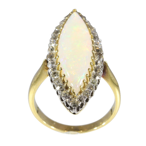 Bague 55 L'élégance victorienne : le chef-d'œuvre de la bague en opale et diamant de 1880 58 Facettes 16054-0031