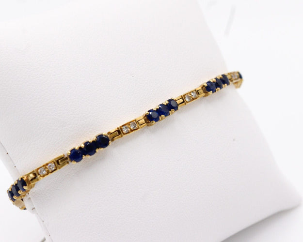 Bracelet Bracelet rivière de diamants et de saphirs, or jaune 58 Facettes 240045