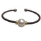Bracelet Bracelet en acier marron avec perle australienne dorée 58 Facettes PUV208