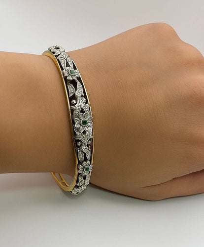Bracelet Bracelet en or jaune orné de motifs floraux en argent, émeraudes et diamants 58 Facettes 50319