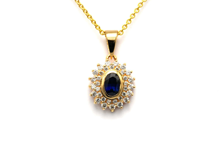 Pendentif Pendentif contemporain en or jaune serti d'un saphir et de diamants 58 Facettes B766