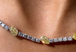 Collier Collier tennis en or blanc 18 carats avec diamants jaunes 58 Facettes G-439