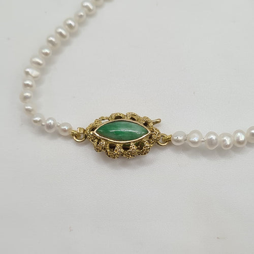 Bracelet Bracelet or jaune 14 carats serti de perles et pierre verte 58 Facettes