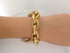 Bracelet bracelet gourmette breloques coeur zodiac t18 or jaune 18k 90.5gr charms 58 Facettes 270131