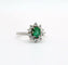 Ring Daisy in white gold adorned with an emerald and diamonds 