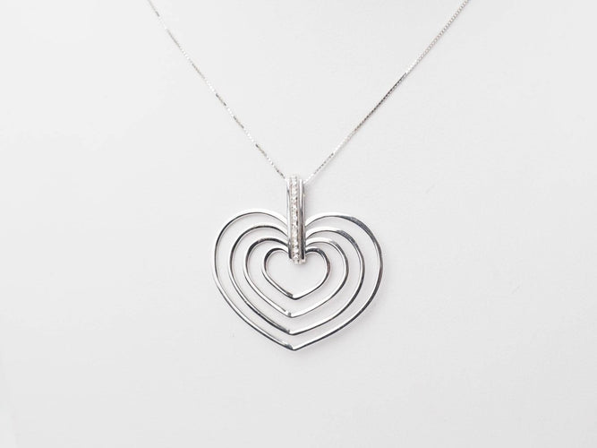 Collier Collier en or blanc et 4 coeurs 58 Facettes 26383