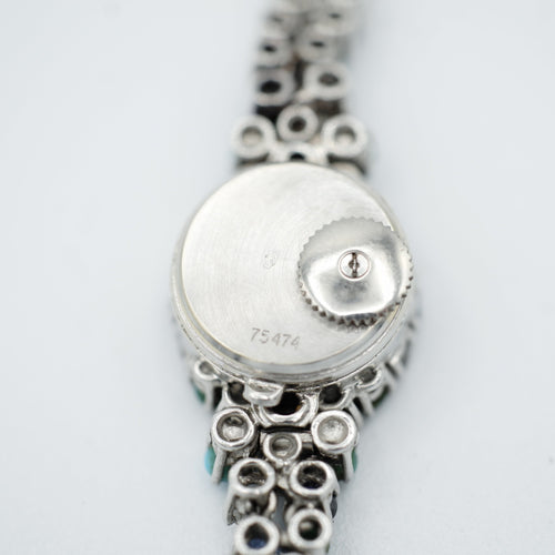 Montre Uti - Montre Ovale - Or Blanc - Diamants, Saphirs et Turquoise 58 Facettes 1.0001001/1