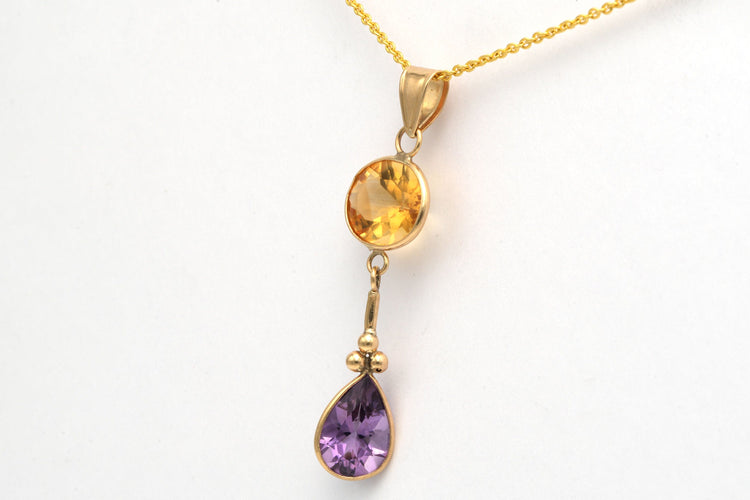 Pendentif Pendentif contemporain en or jaune, améthyste et citrine 58 Facettes 10798