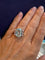 Bague 54 Bague cocktail en or gris ornée d'une aigue-marine et diamants 58 Facettes