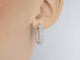 Boucles d'oreilles Boucles d'oreilles créoles en or blanc avec cinq chatons et diamants 58 Facettes 2111