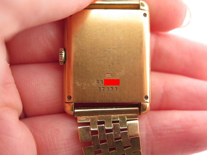 Montre vintage montre baume & mercier tank 37077 mecanique or 18k & oeil de tigre 58 Facettes 268283