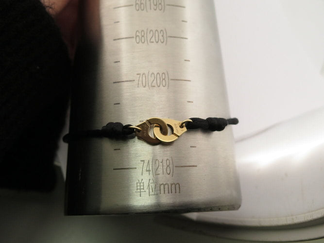 Bracelet bracelet DINH VAN menottes r10 341102 en or jaune 18k 2.9gr & cordon noir 58 Facettes 270151