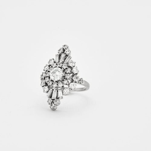 Bague 54 Bague marquise or gris, platine, diamants 58 Facettes