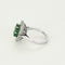 Bague 50 Bague marguerite en or blanc, émeraude et diamants 58 Facettes B250523