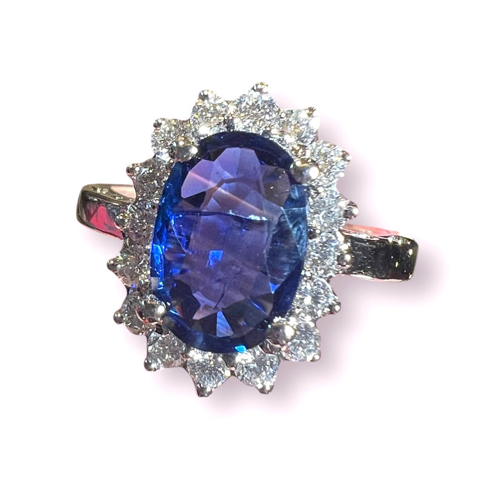 white gold sapphire ring surrounded by diamonds