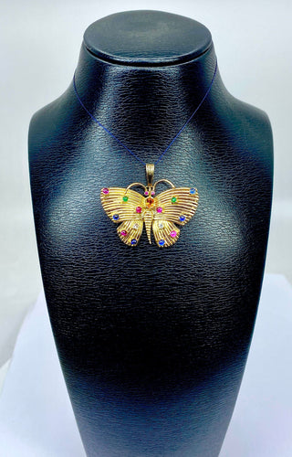 Pendente a farfalla in oro giallo e pietre preziose 