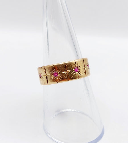 Bague 54 Large bague jonc Art Déco or rose, rubis sertis étoilés (circa 1950) 58 Facettes A05174