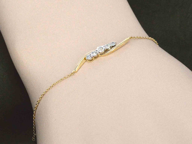 Bracelet Bracelet en or jaune avec diamants sertis en rang 58 Facettes 2361