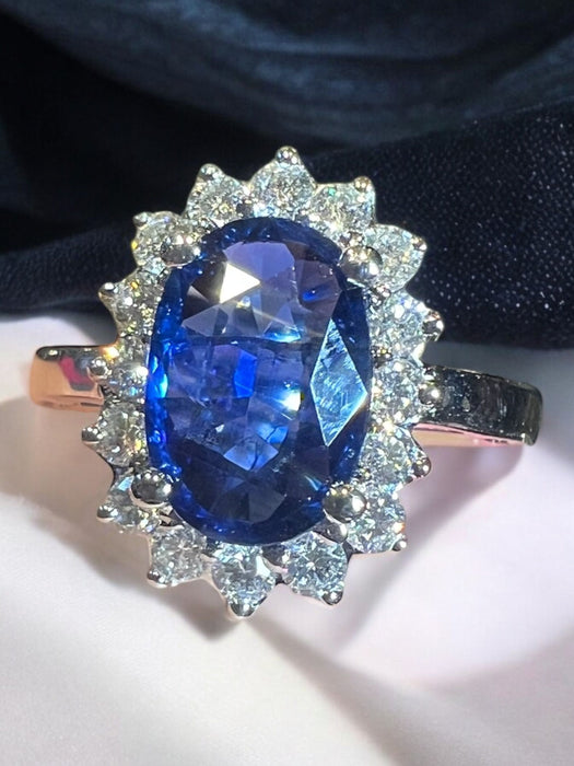 white gold sapphire ring surrounded by diamonds