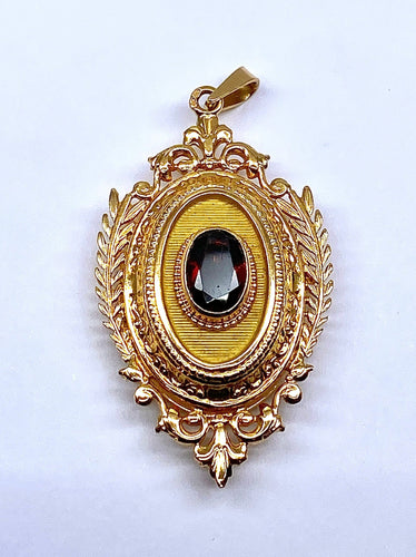 Pendentif Pendentif porte souvenir ouvrant en or et grenat 58 Facettes AB574