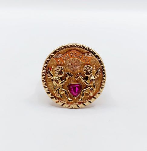 Bague 55 Bague vintage "il bat pour toi" or rose, angelots sculptant un coeur en rubis synthétique 58 Facettes A05267