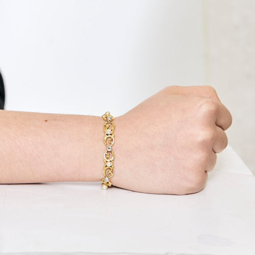 Bracelet Bracelet or jaune et gris, perles et diamants 58 Facettes ENG10572