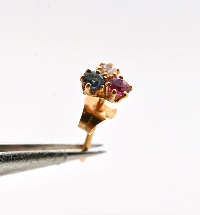 oorbellen in 18-karaats goud versierd met een saffier, een robijn en een diamant