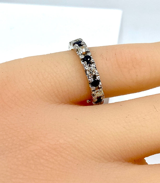 White gold wedding ring with 9 sapphires and 9 diamonds