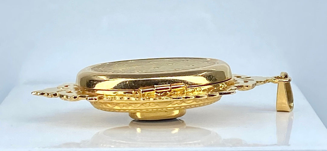 Pendentif Pendentif porte souvenir ouvrant en or et grenat 58 Facettes AB574