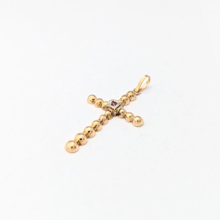 Yellow gold and ruby cross pendant