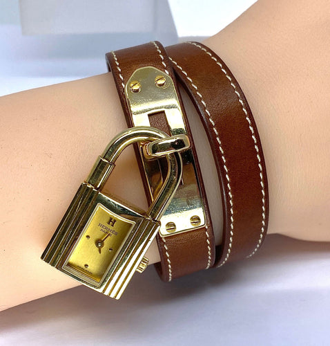 Montre Montre Hermès «  Kelly », cadran PM plaqué or, double tour cuir marron 58 Facettes AB453