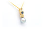 Pendentif Pendentif en or jaune serti d'un saphir et d'une perle de Tahiti 58 Facettes 22416