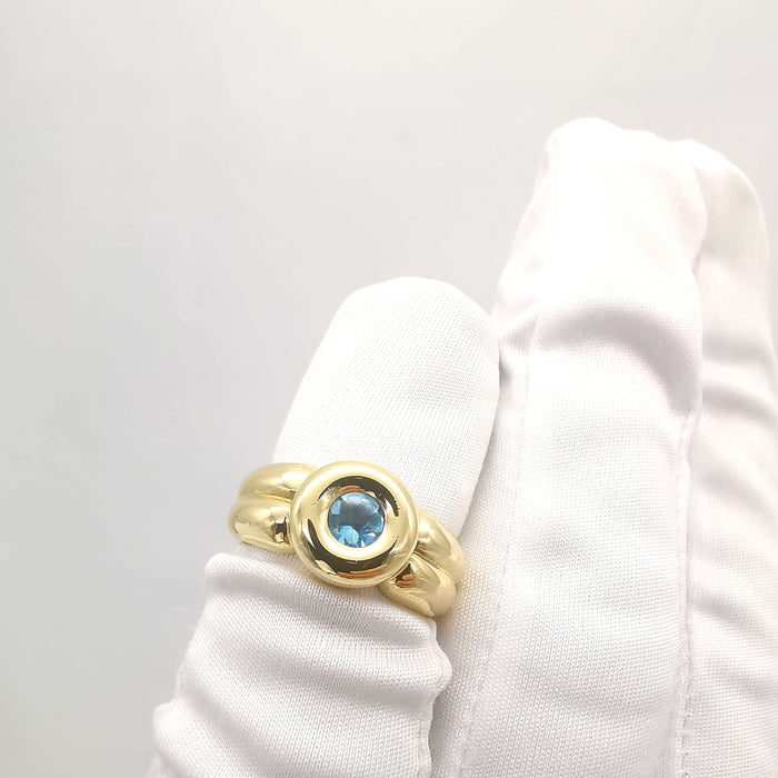 Anello in oro giallo con topazio