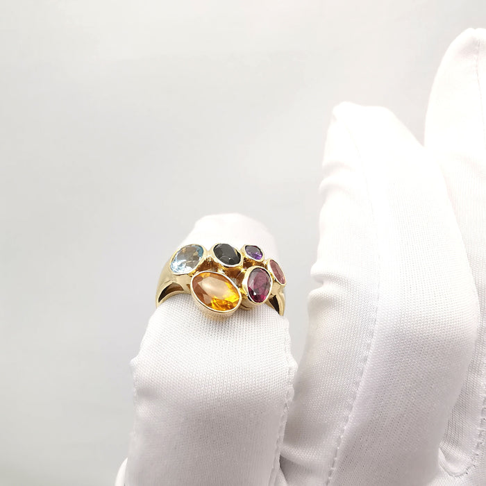 Yellow gold ring with precious stones